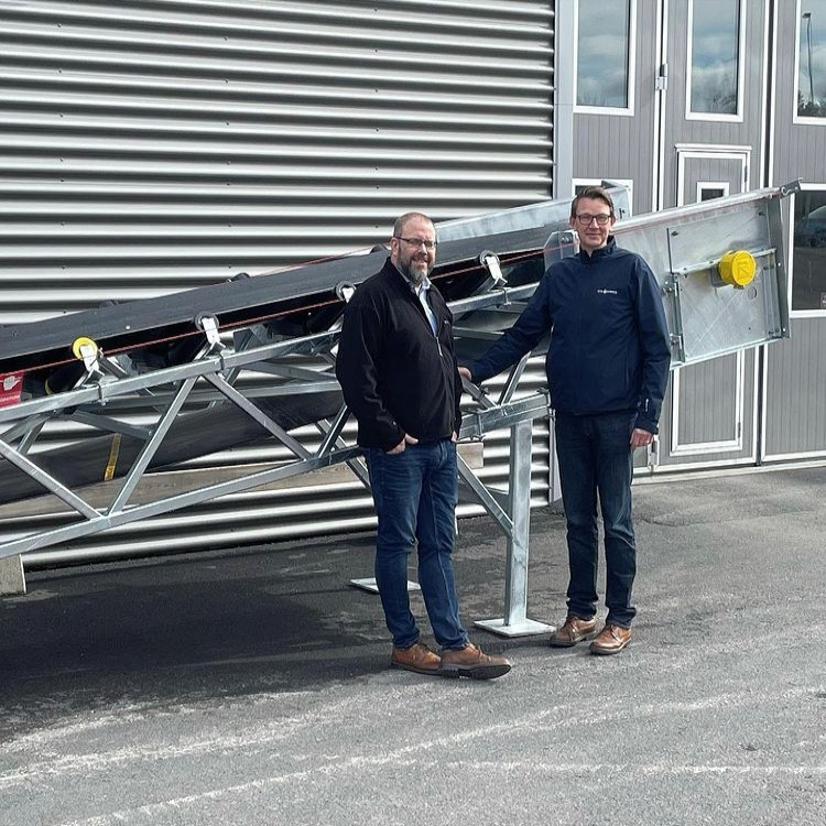 About Vendig - Sören & Mårten in front of our newly purchased conveyour.